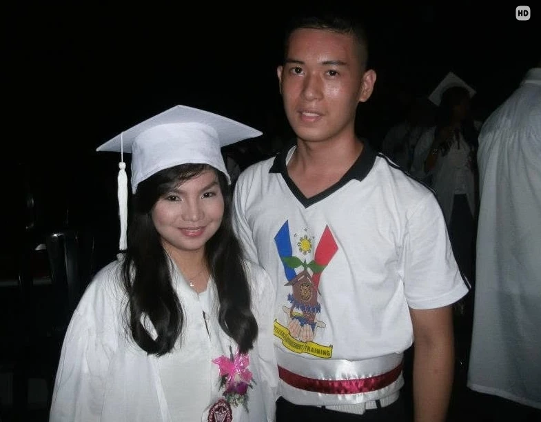Graduation day, cap and gown beside a training uniform